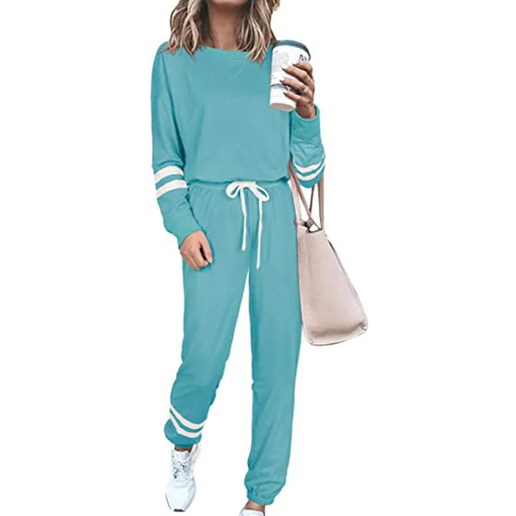 Women's plus size casual two-piece suit set in a solid colour, showing loose-fitting long sleeve top and trousers.