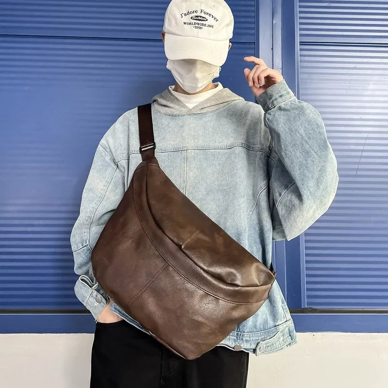Retro large capacity men's crossbody bag in brown PU leather with zipper closure on white background.