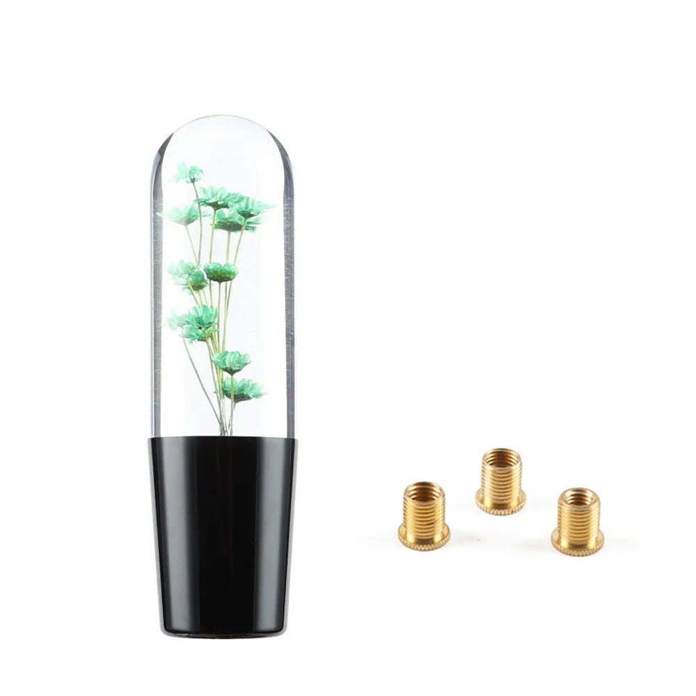 Transparent crystal car gear shift knob in assorted colours with three metal adapters.