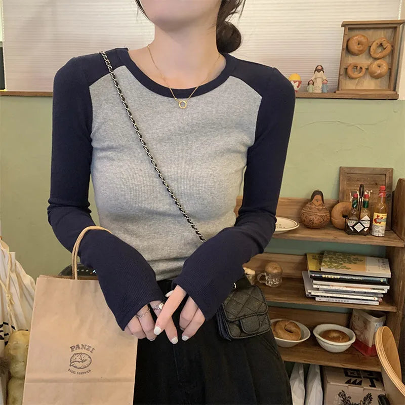Women's oversized long sleeve top in dark blue black or green with princess sleeves and embroidery details