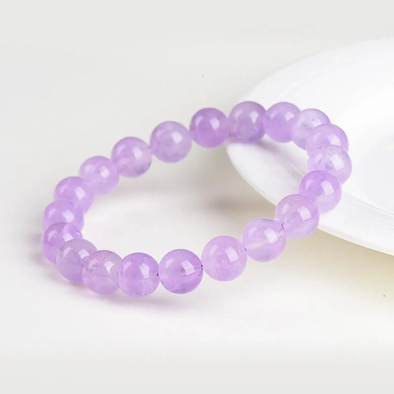 Lavender amethyst bracelet with water ripple texture on round beads in unisex design.