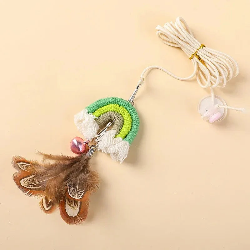 Cat door swing toy with colourful feathers on elastic cord attached by sticky buckle clamp