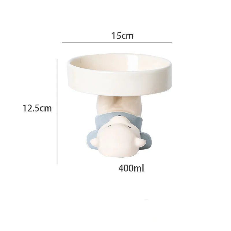 Raised ceramic cat bowl in animal design, showing elevated feeder stand and wide food bowl opening.