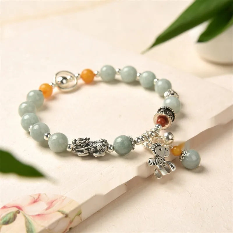 Natural emerald green jade vintage pony style bracelet with an alloy clasp.