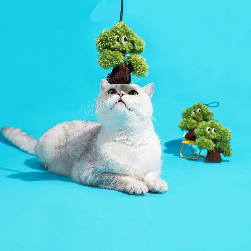 Green pine tree shaped cat toy with hanging loop for biting and interactive play