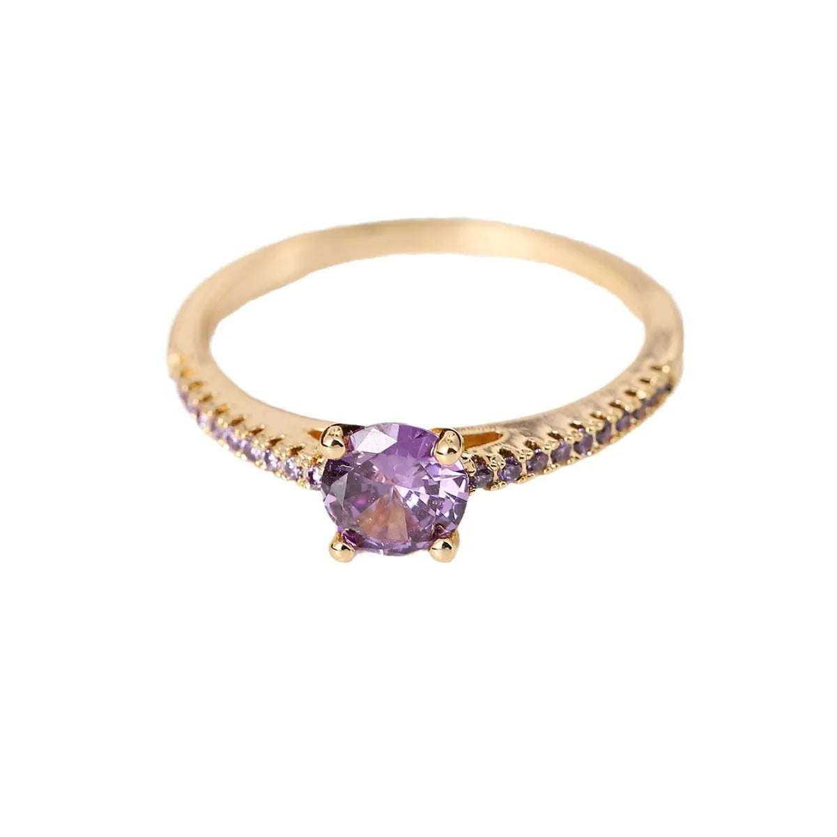 Hexagonal geometric copper ring with zircon electroplating in a gold rose red finish on a hand.