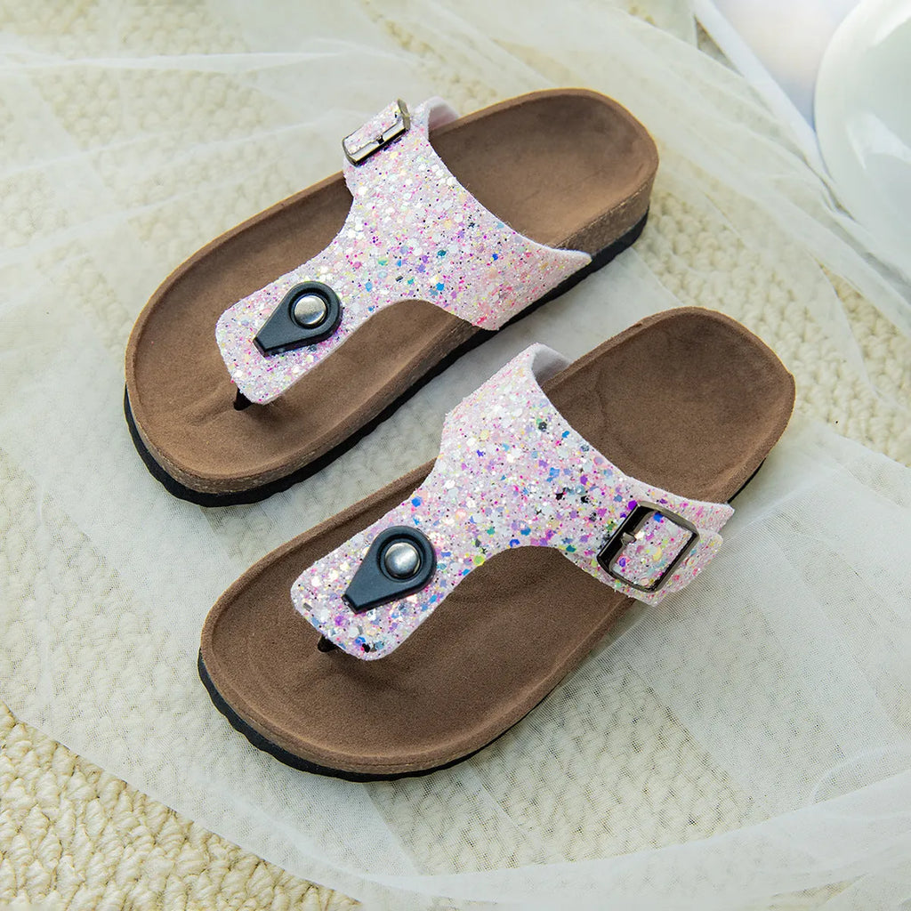 Women's cork flip-flops with frosted metallic artificial leather upper and textured PVC sole.