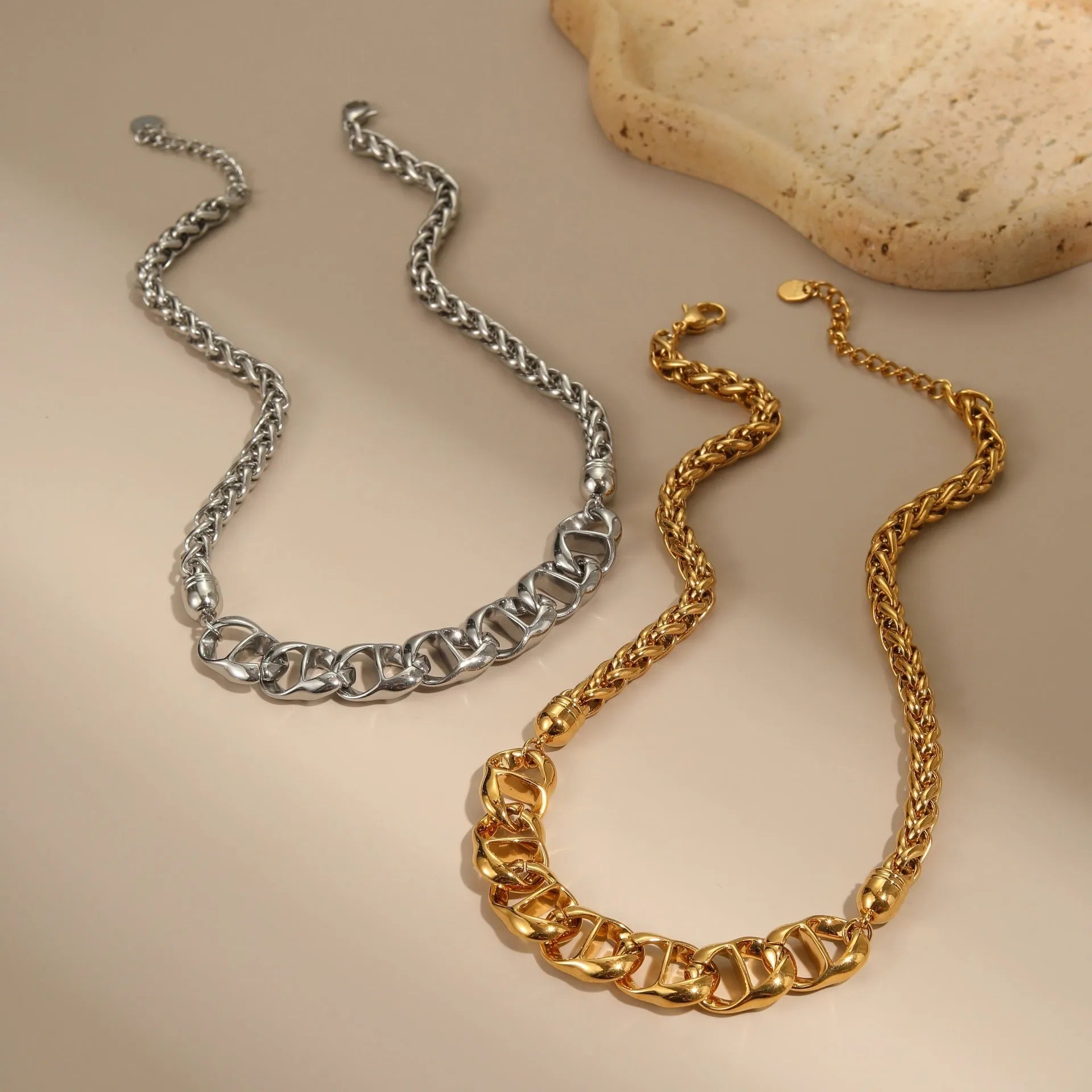 Gold electroplated stainless steel necklace with geometric pendant on regular chain
