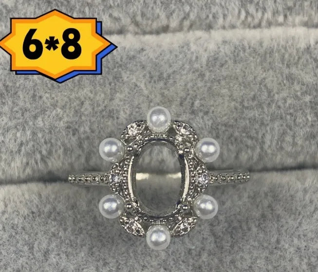 Open-mouth oval denier ring with a 6x8mm stone and five-pointed star decoration on a copper band.