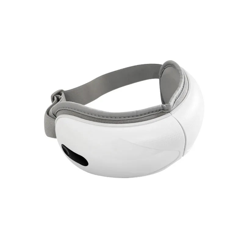 White rechargeable eye massager with hot compress and airbag massage functions on a grey background