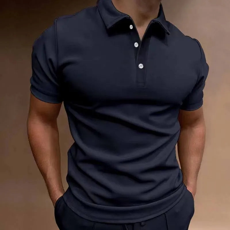 Man wearing a loose fit grey cotton blend T-shirt with a button-down front and short sleeves.