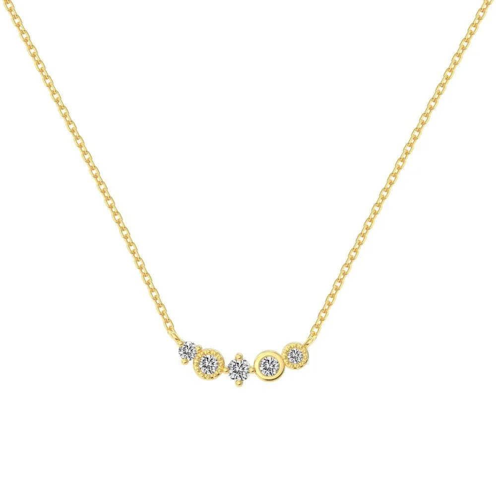 Geometric zircon pendant necklace in 925 silver with gold electroplate finish on display