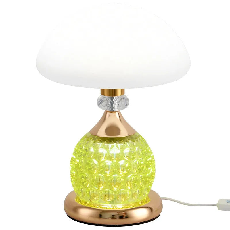 Light luxury mushroom table lamp with carved base in transparent colour on a wooden bedside table