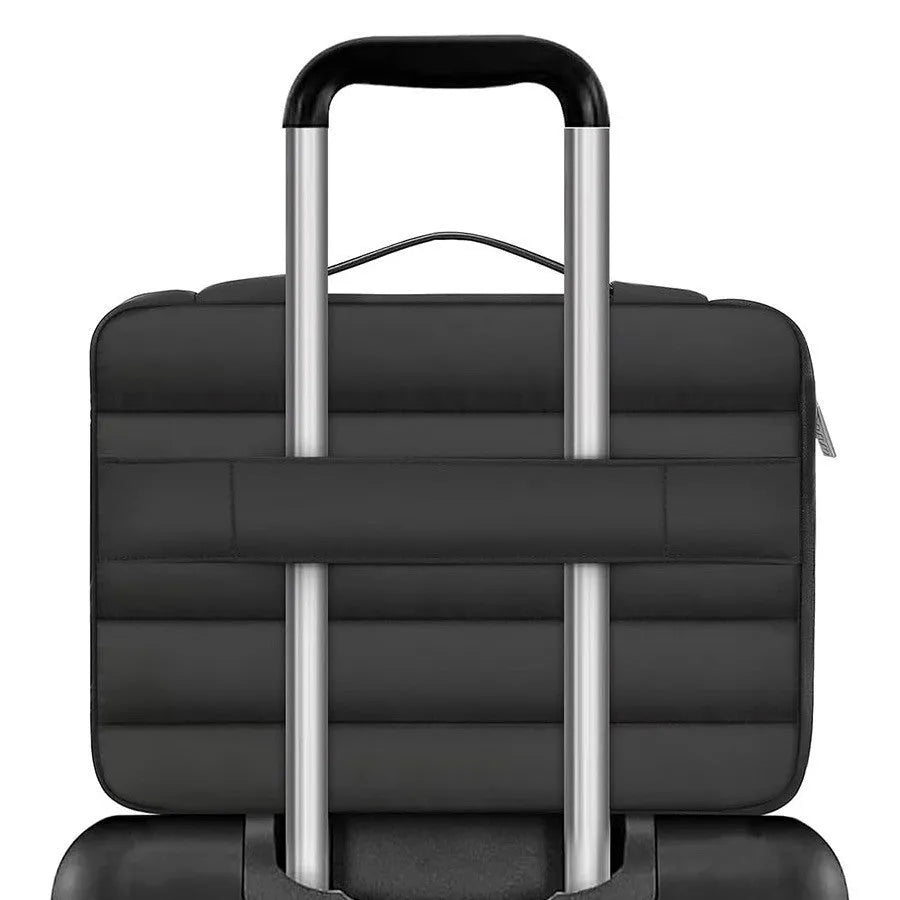 Cotton velvet laptop storage bag in black with plaid pattern, shown next to a laptop.