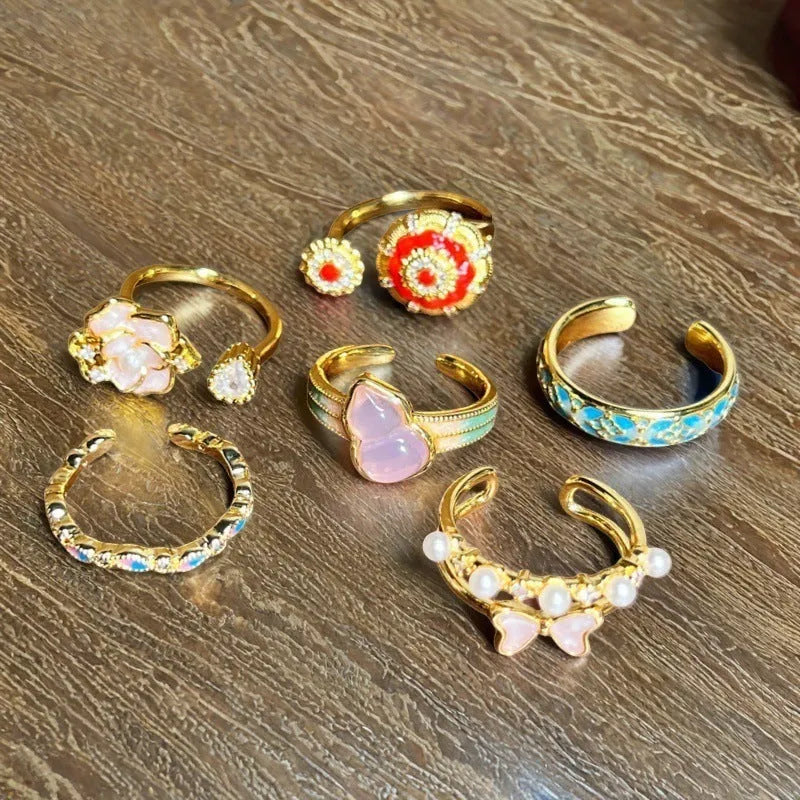 Adjustable gourd vintage ring with oil dripping finish in New Chinese style showing bow-shaped elements and zircon details