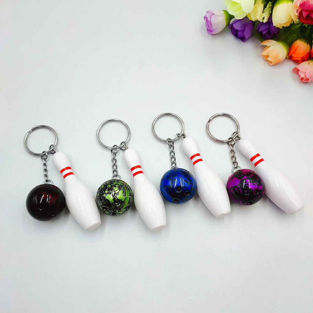 Mini bowling pin keychain pendant in four colour options with key ring attachment