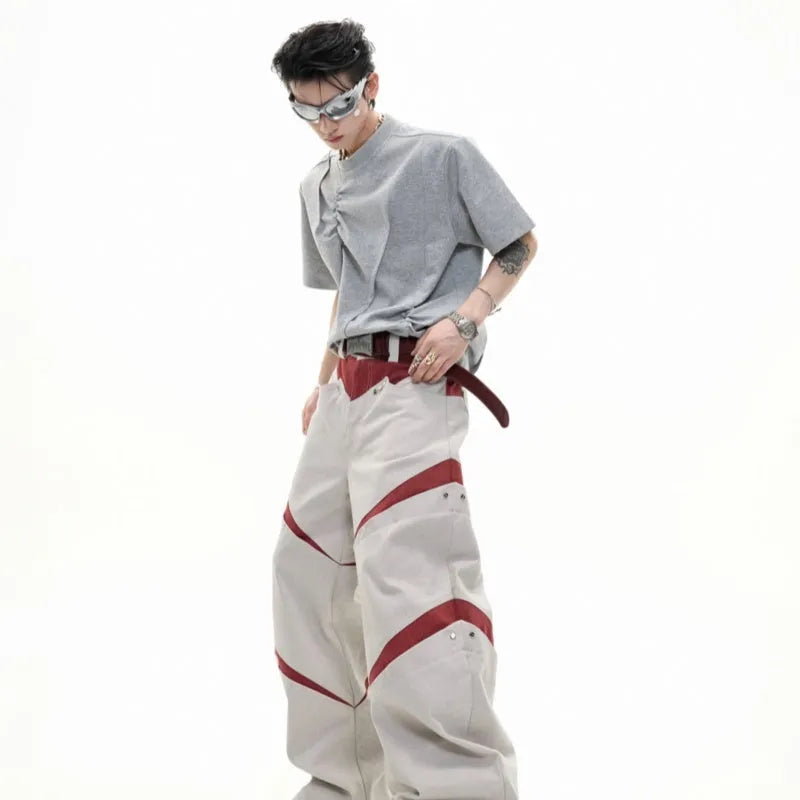Men's grey cotton T-shirt with pleated detail and a round neck on a hanger.