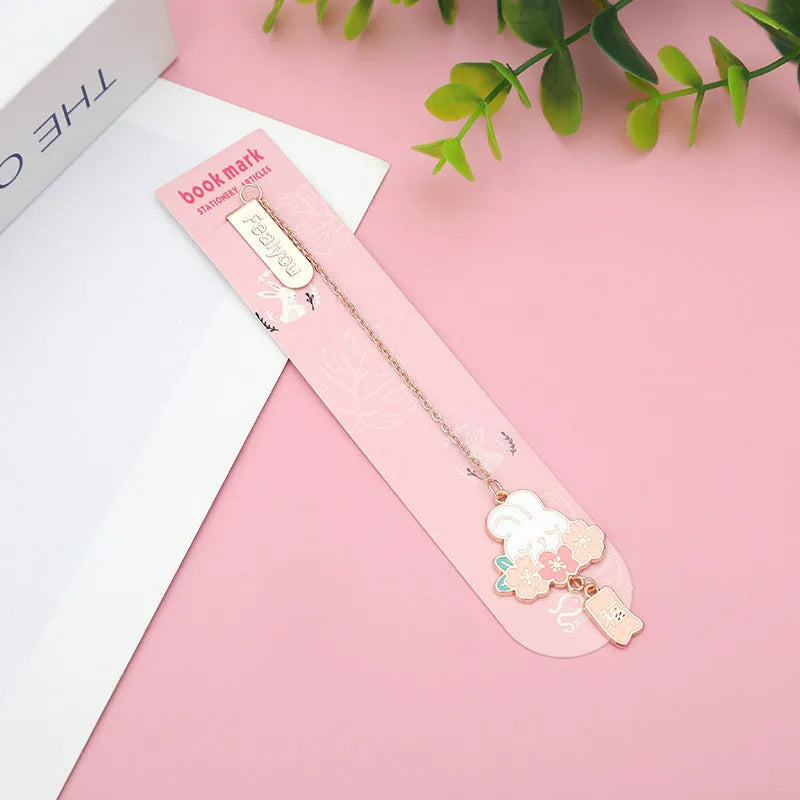 Creative cartoon metal pendant bookmark holder with cherry cat design.