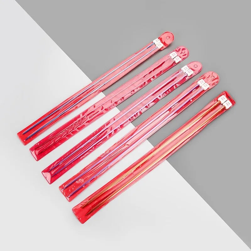 Set of lengthened crochet hooks with caps in 13 sizes from 2.0mm to 10.0mm, two hooks per size.