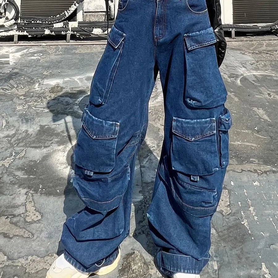 Dark blue distressed women's jeans with a high waist, wide legs, and multiple pockets on a mannequin.