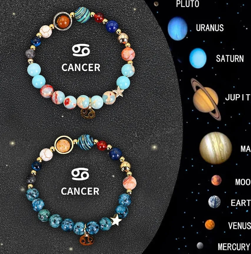 Two natural stone beaded bracelets on a table representing zodiac sign jewellery.