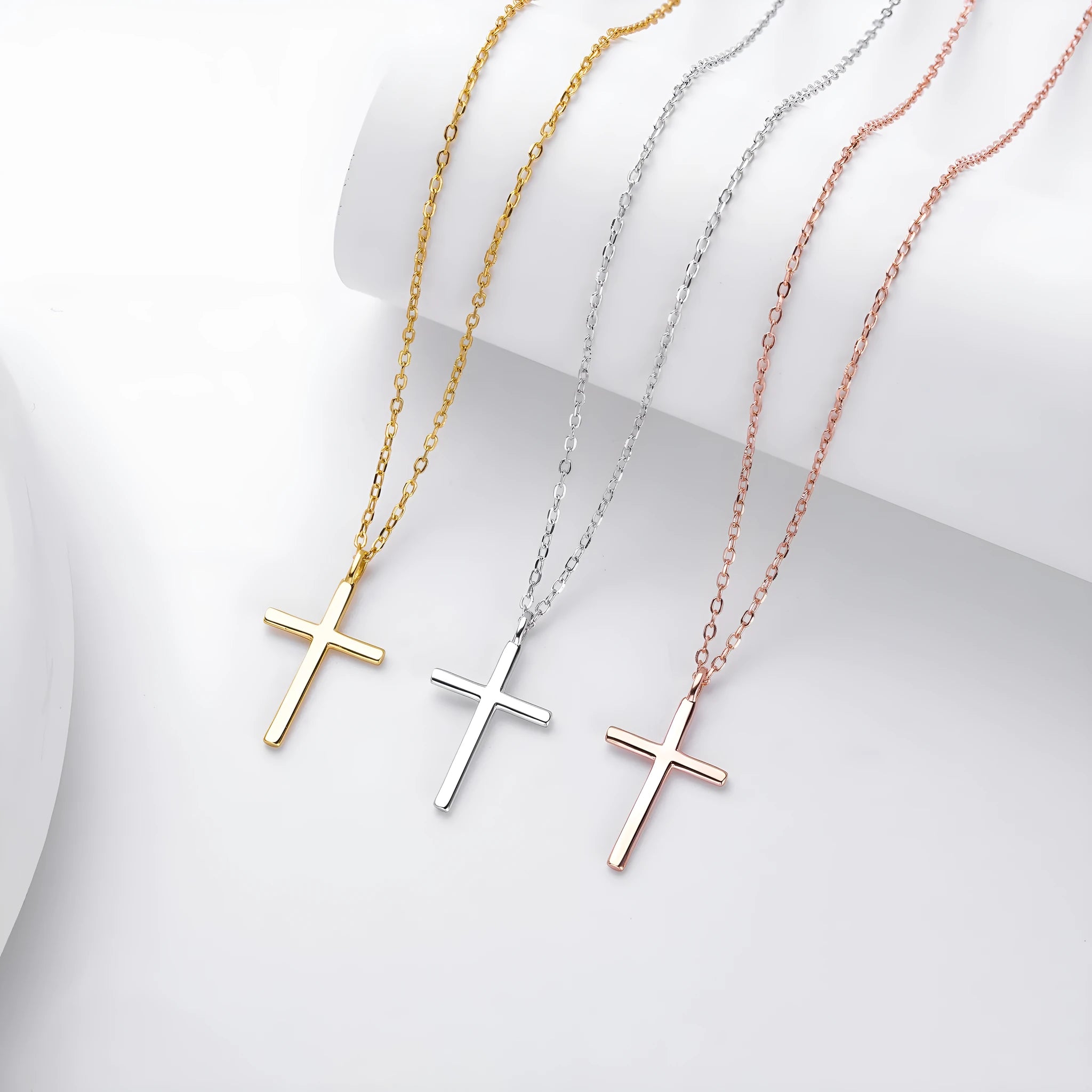 Simple sterling silver cross pendant necklace with glossy finish on adjustable O-link chain