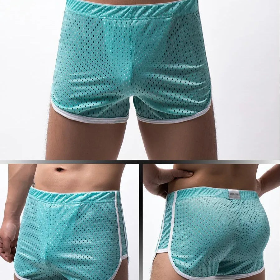 Men's solid colour boxer shorts in a cotton and nylon fabric blend, shown in black, on a mid-waist fit model.