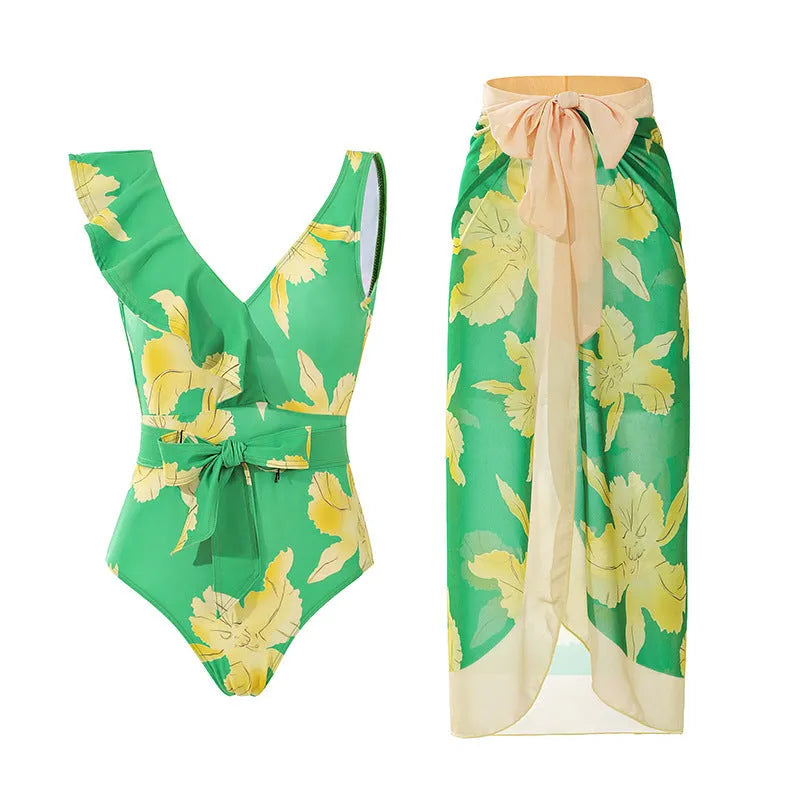 Solid colour women's one-piece swimsuit with spaghetti straps and a matching skirt.