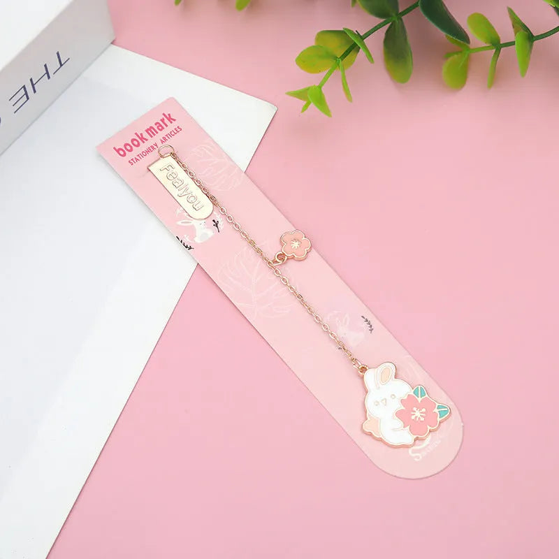 Creative cartoon metal pendant bookmark holder with cherry cat design.