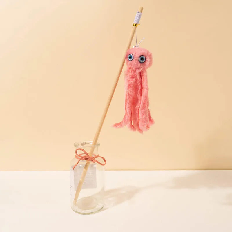 Grey furry octopus cat toy with eyes on a long stick for interactive indoor play with kittens.