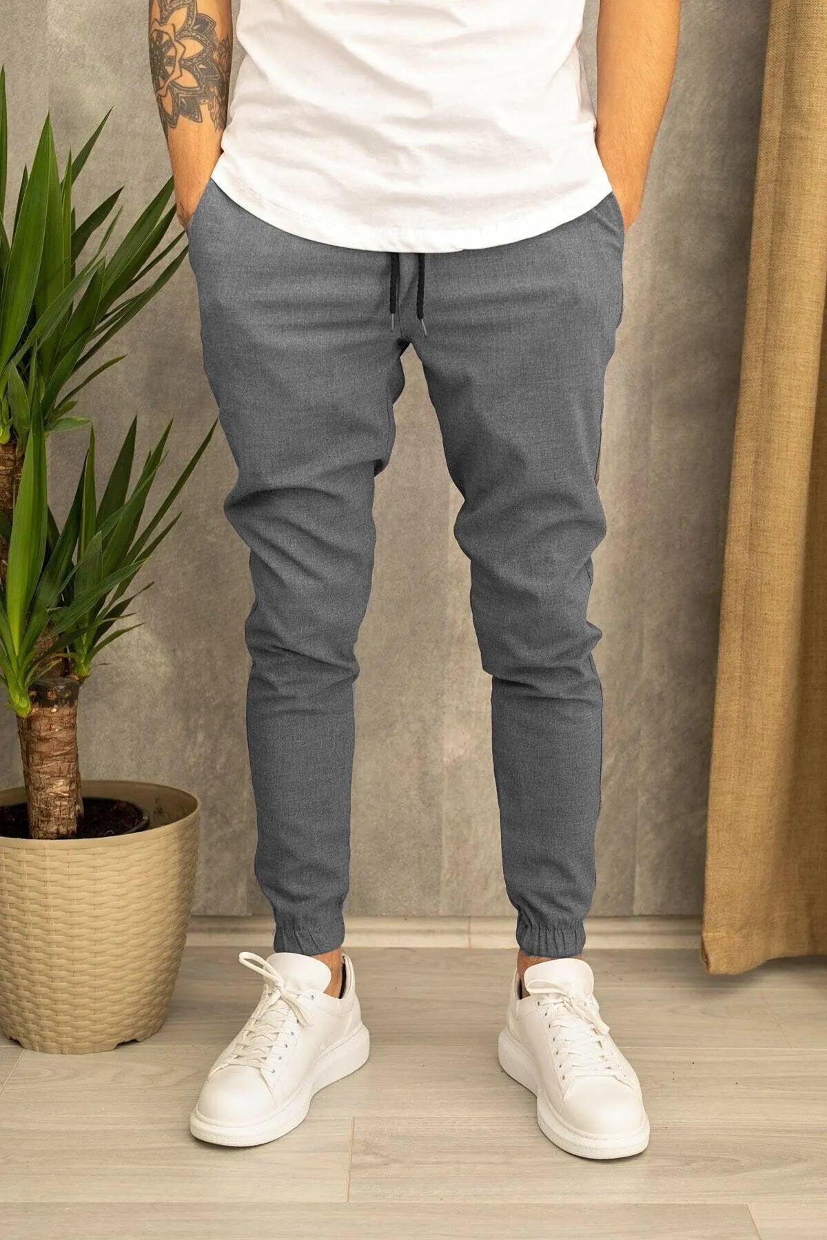 Men's casual plain cotton trousers with belt, tight-fitting pencil pants style, available in black grey khaki