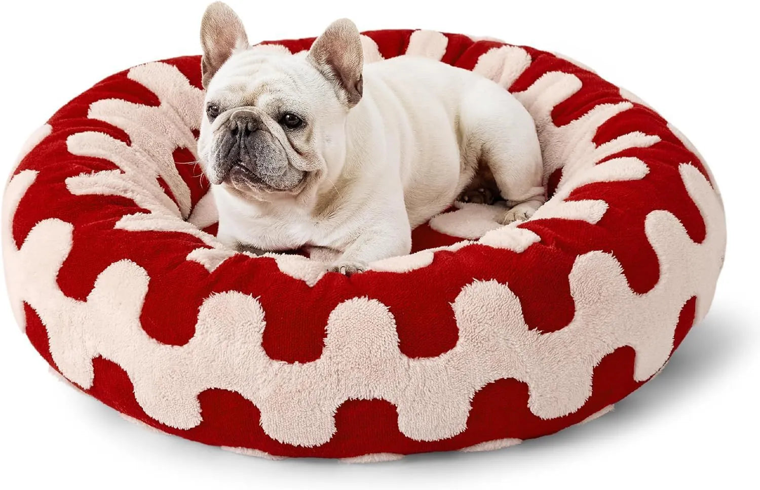 Round plastic dog bed with a blue and white plaid fabric cover, shown on a wooden floor.