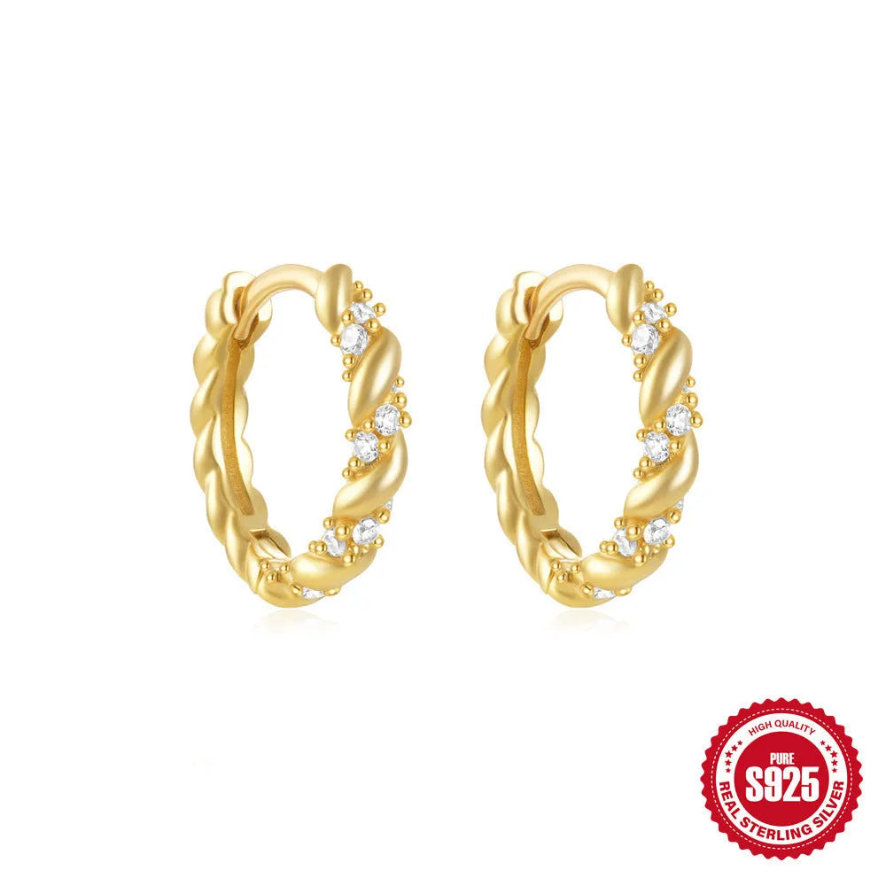 Small round geometric sterling silver stud earrings in gold and silver electroplated finishes.