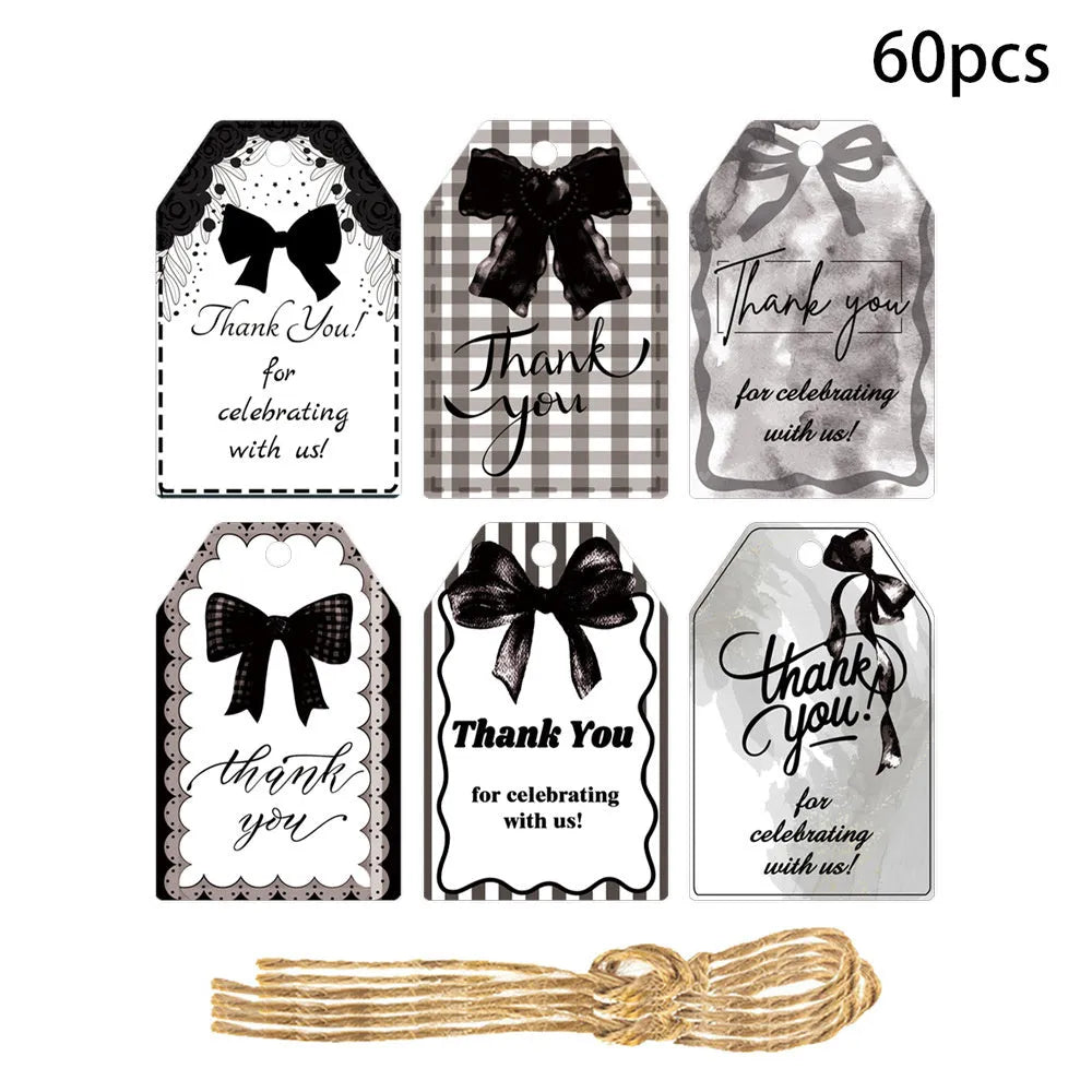 Set of 60 paper birthday gift tags with natural hemp rope in three bowknot designs.