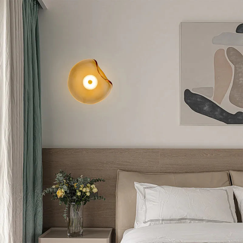Round glass bedside wall lamp in cognac, light purple, or smoky grey colour.