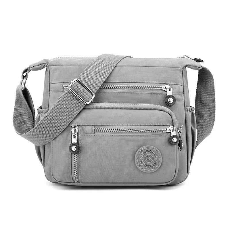 Soft nylon large capacity square messenger bag in multiple colour options on a single shoulder strap.