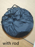 Black pop-up tailgate tent unfolded next to a car, showing its cubic 200cm shape and quick-throw design.