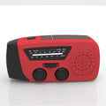 Red rechargeable hand torch with AM/FM radio, wrist strap, and USB charging interface