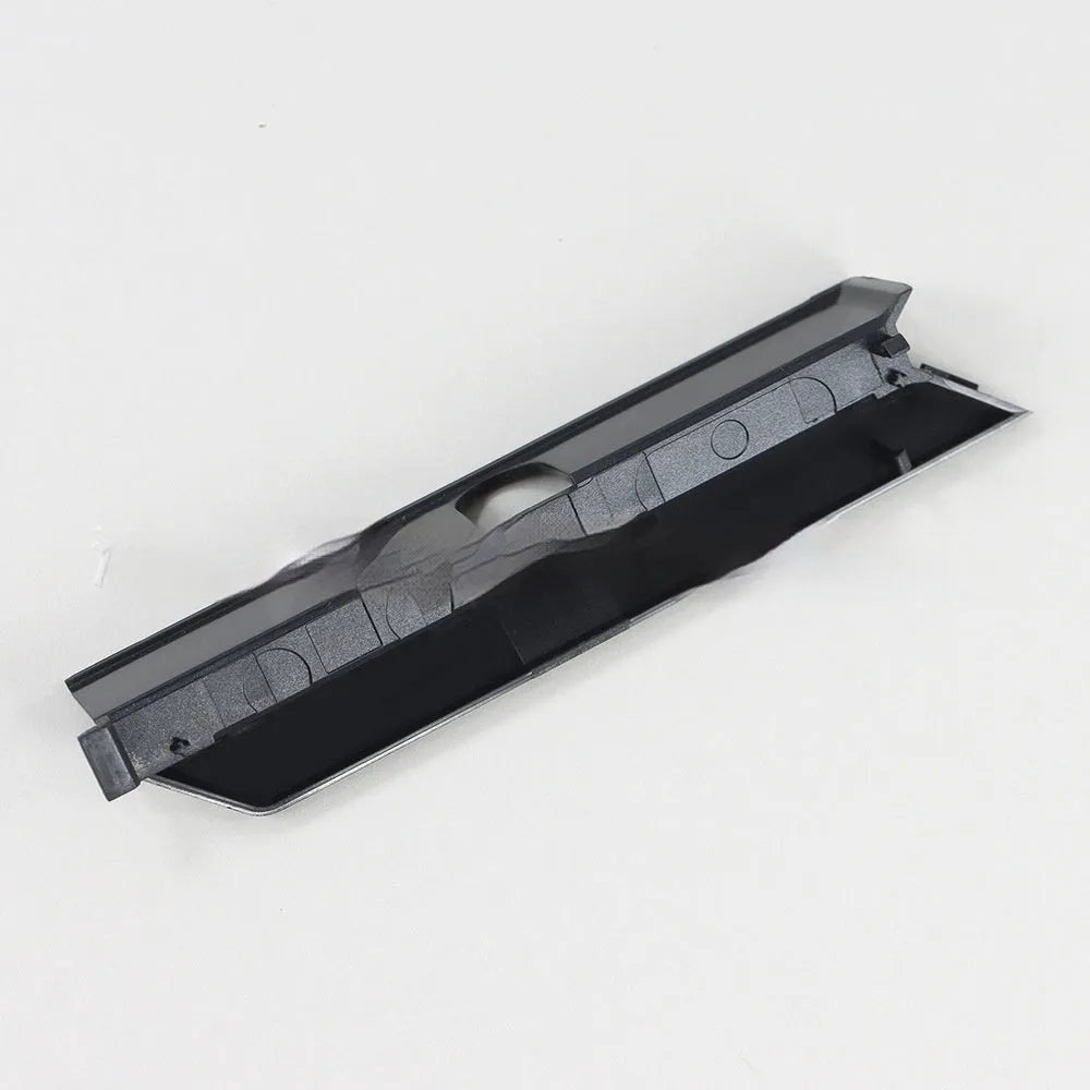 Black and white plastic hard disk baffle cover for 3.5-inch internal drive bays.
