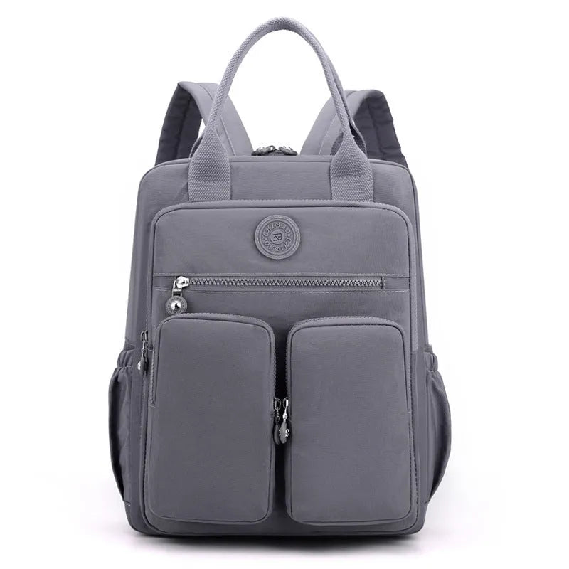 Women's waterproof nylon travel backpack with multiple internal compartments in various colours