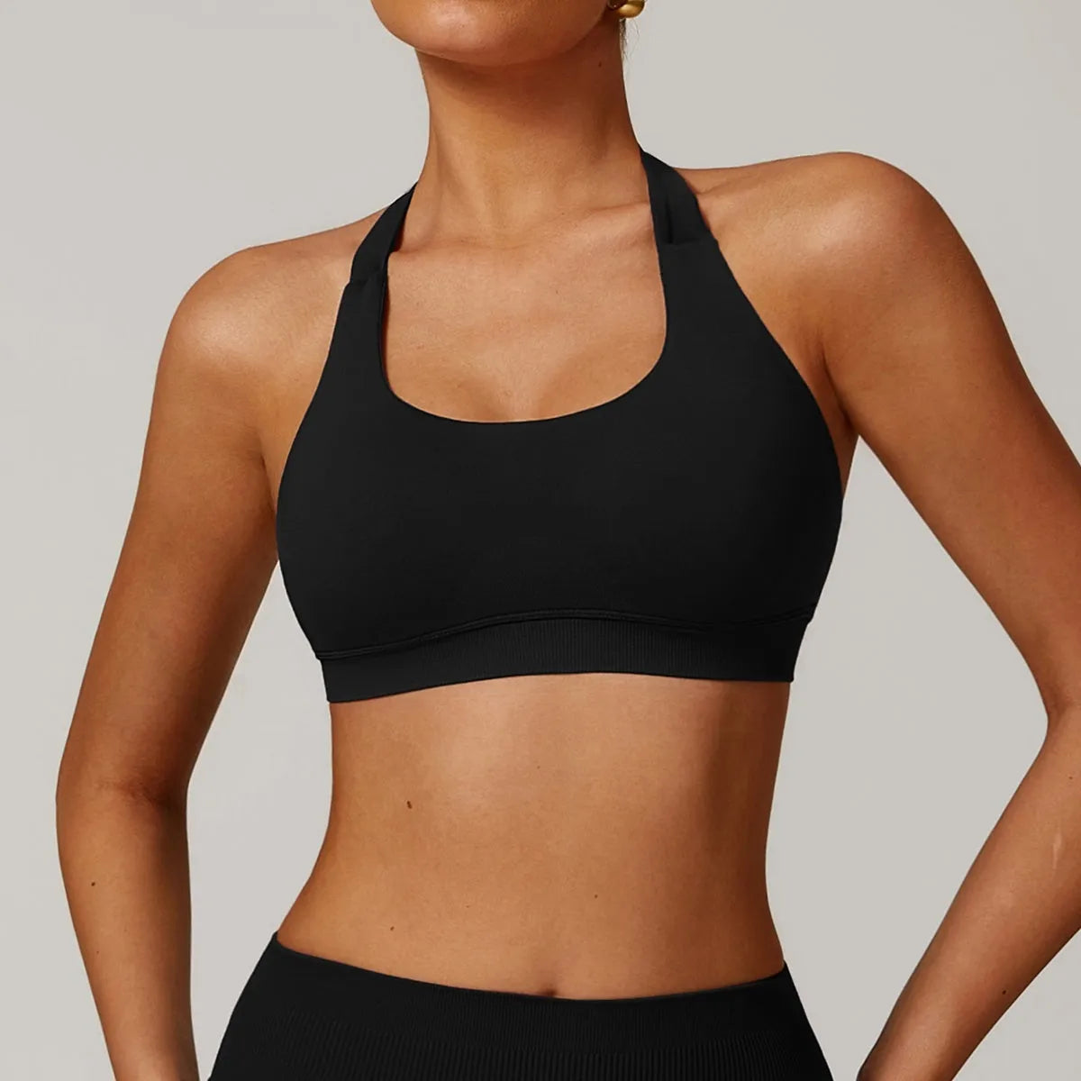 Halter neck sports bra for women in multiple colours with medium support and built-in chest pads