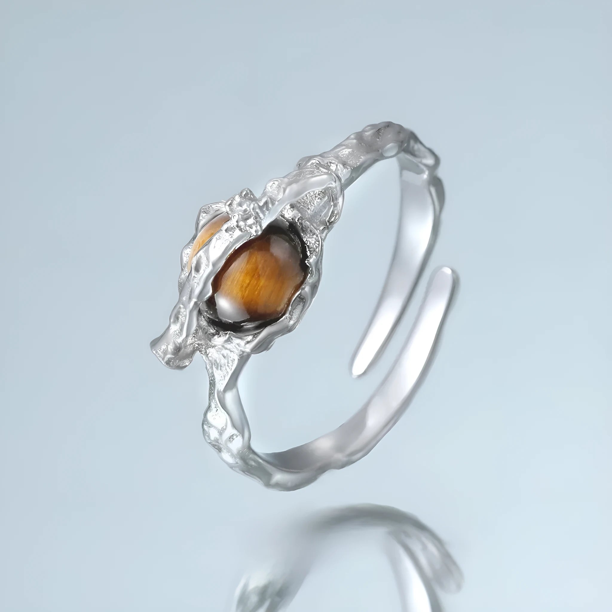 Silver Saturn planetary motif open ring with adjustable size and white gold electroplated finish