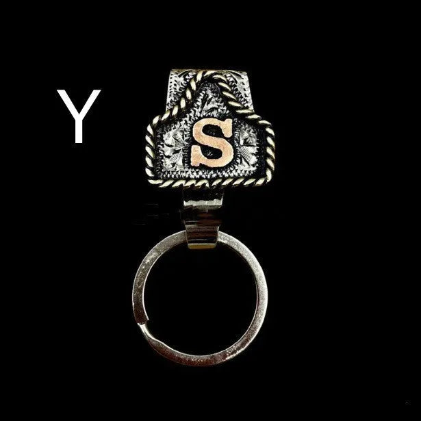 Handmade metal keychain with a cow tag charm in one of 26 available colour options.