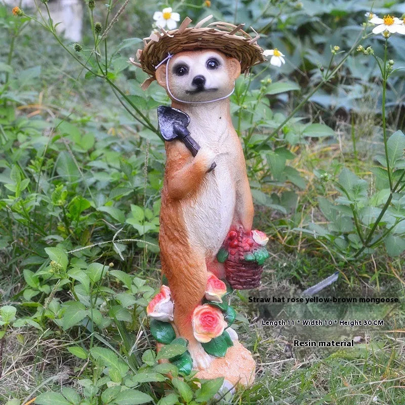 Three resin mongoose garden ornaments with straw hats, including figures holding rake and shovel tools