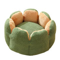 Green cactus petal shaped enclosed soft plush bed for a cat or small dog on a hardwood floor.