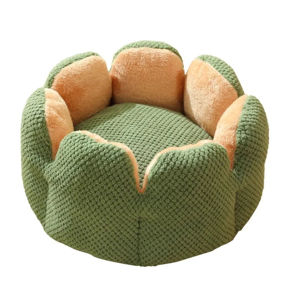 Green cactus petal shaped enclosed soft plush bed for a cat or small dog on a hardwood floor.