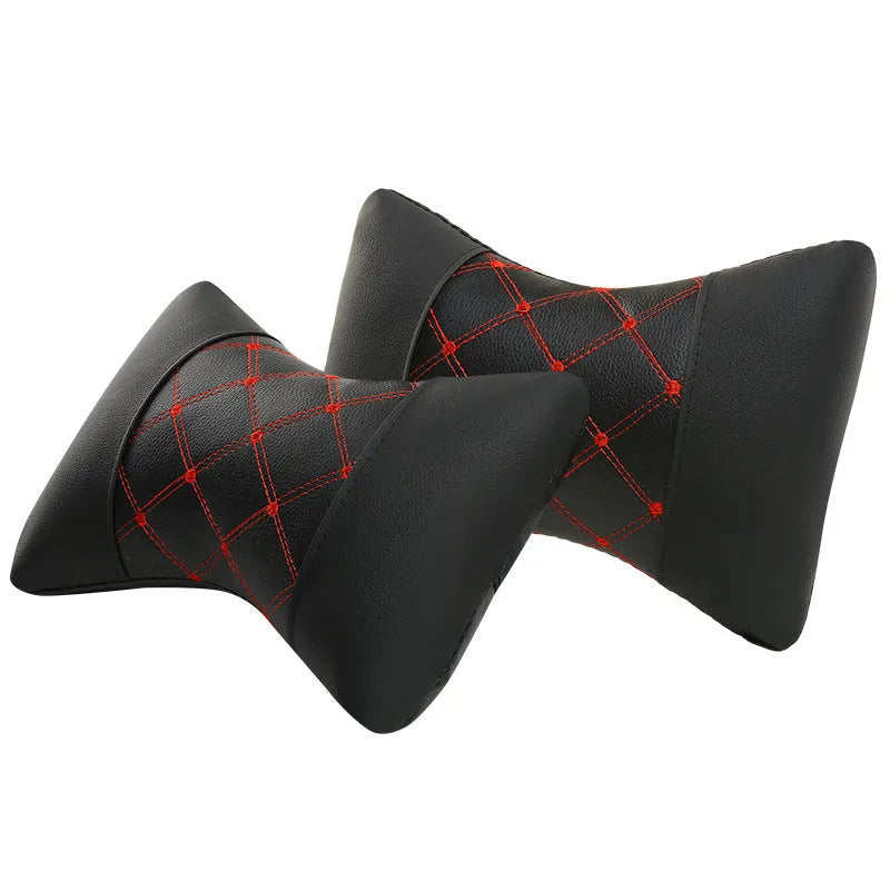 Black leather quilted car headrest neck pillow with diamond pattern and contrast stitching.