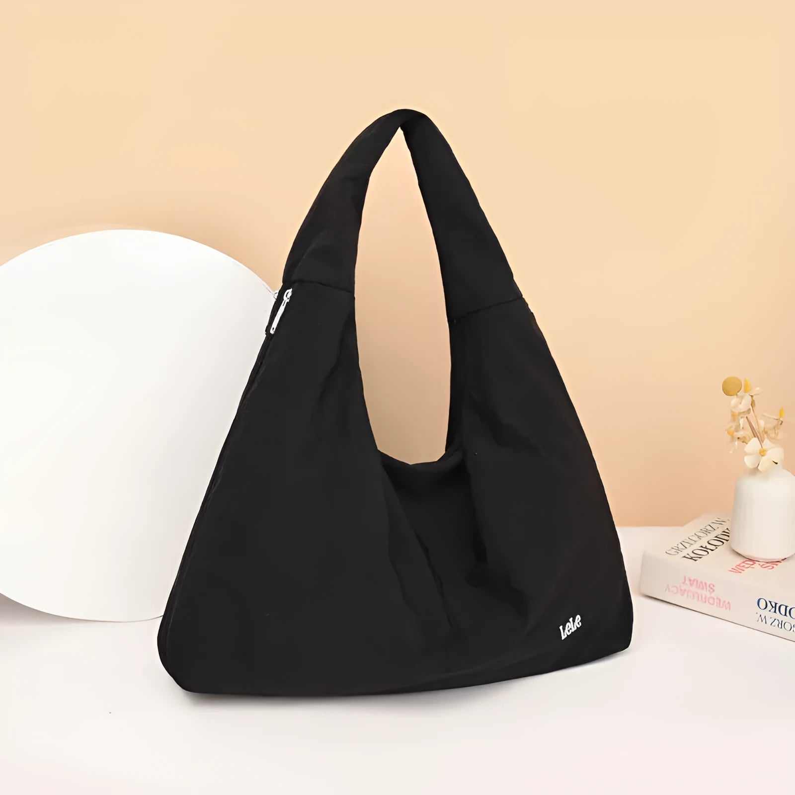 Women's soft nylon underarm bag in a heart shape, shown in black, blue, khaki, and yellow colour options.