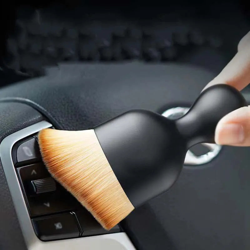 Car interior cleaning brush with soft PVC bristles, shown in white, pink, and black colour options