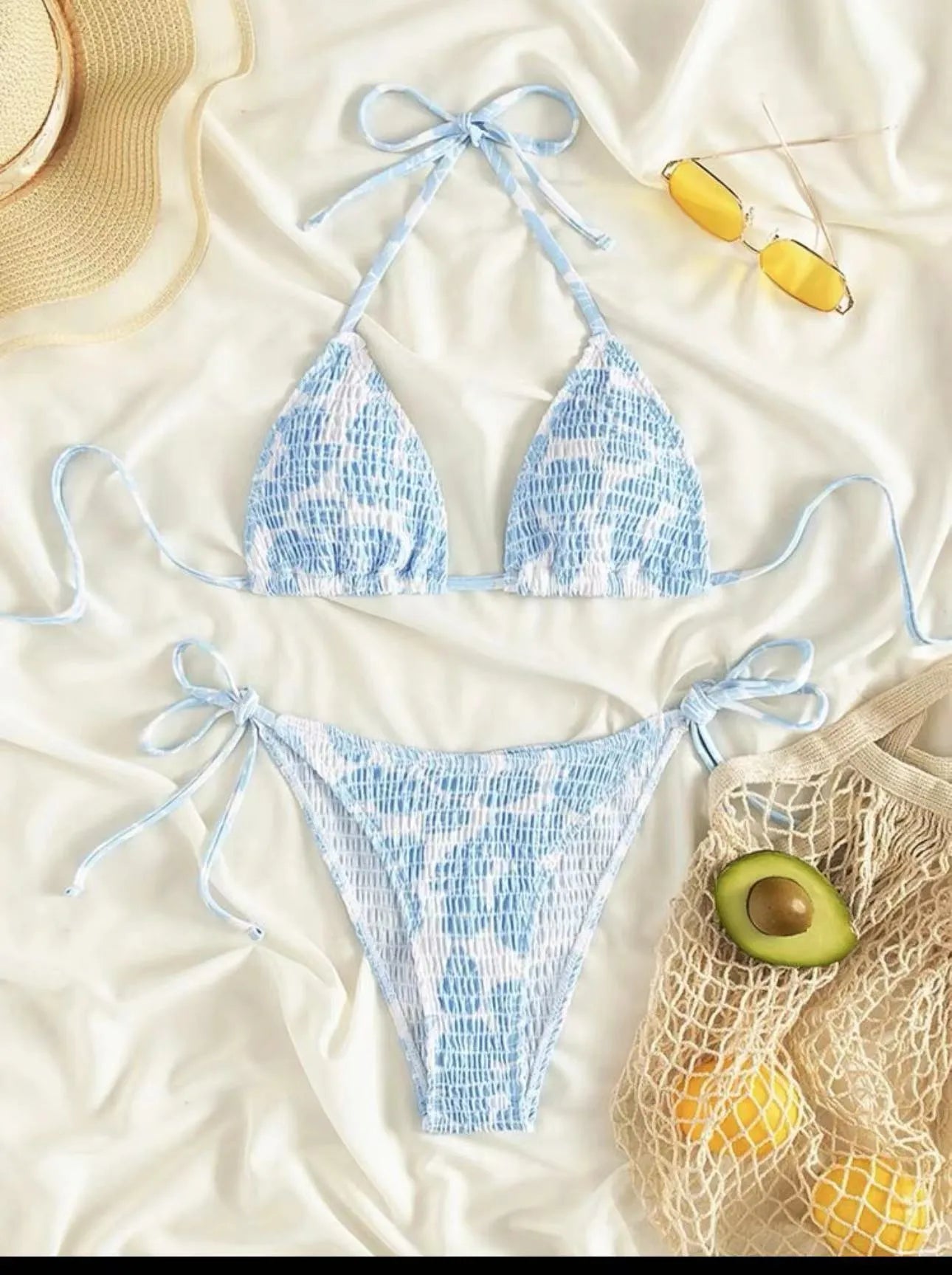 Women's floral patterned halter-neck bikini set in multiple colours on a mannequin